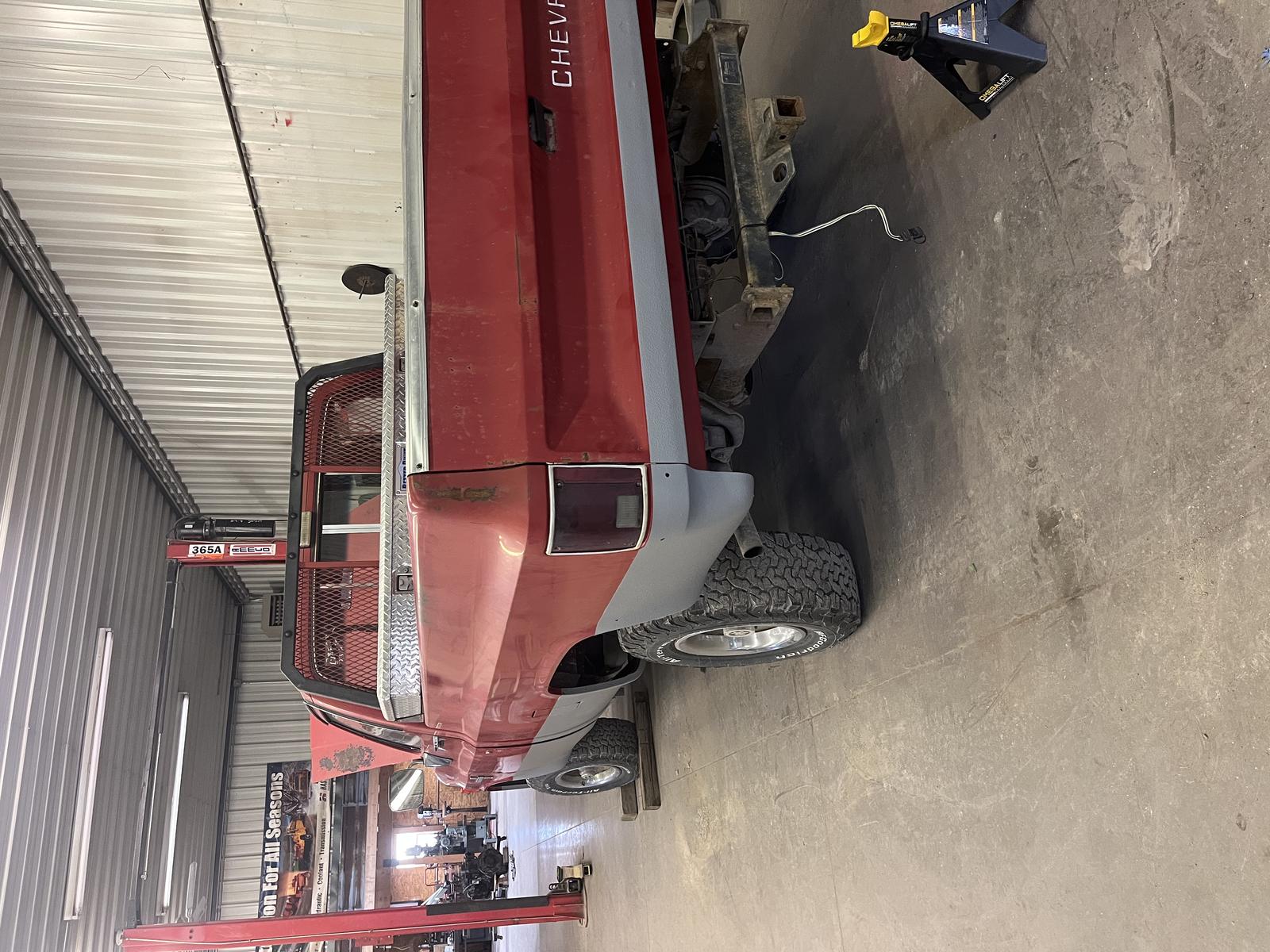 Square body Chevy in shop